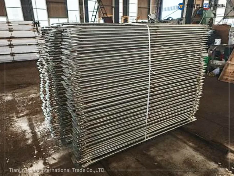 Bundled galvanized facade scaffolding frames tied before loading=