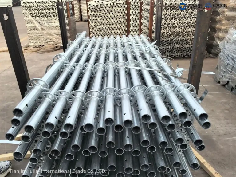 Finished 48-series ringlock horizontal members stacked in steel racks before shipment